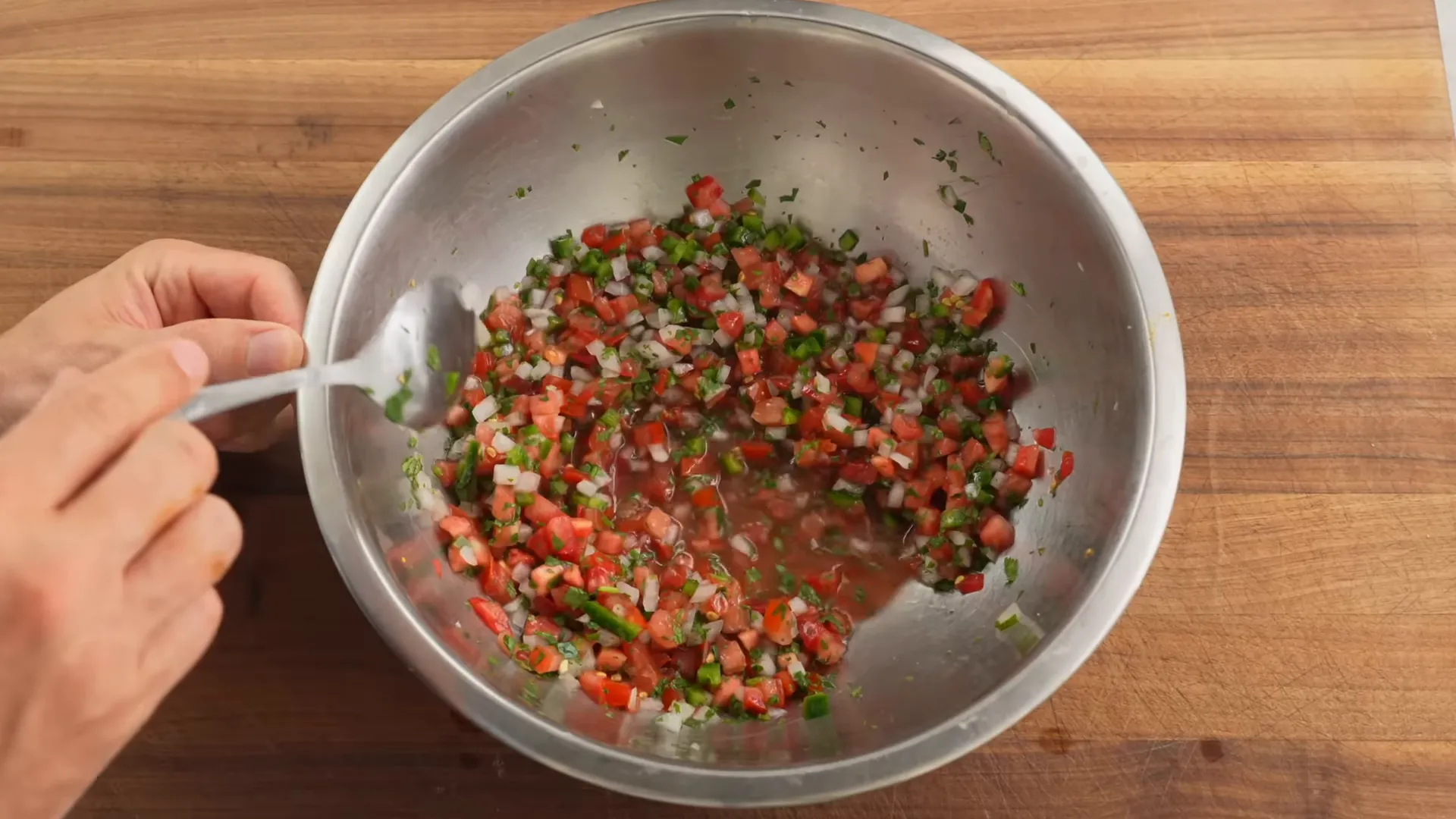 Fresh pico de gallo in a bowl with bright tomato juices