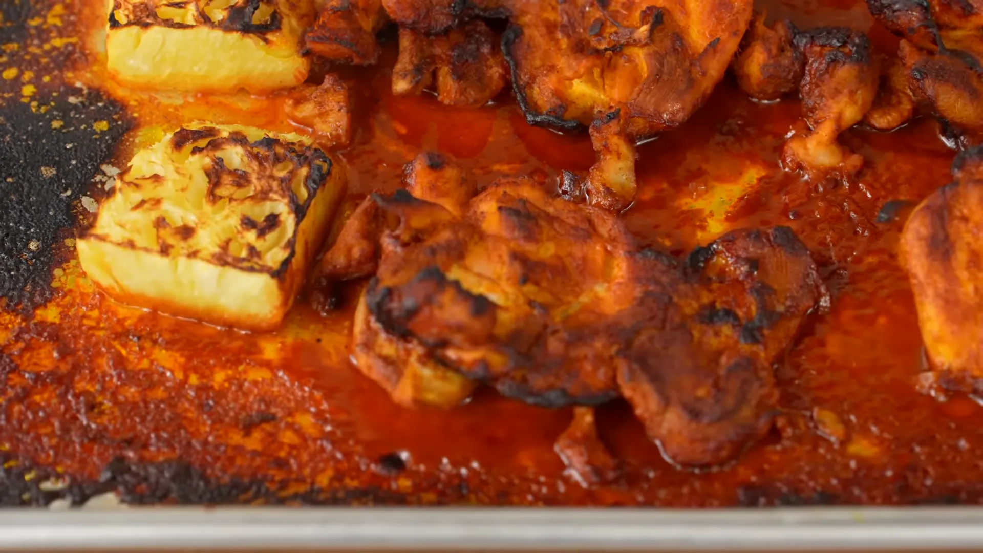 Broiled Al Pastor thighs with roasted pineapple on the sheet tray