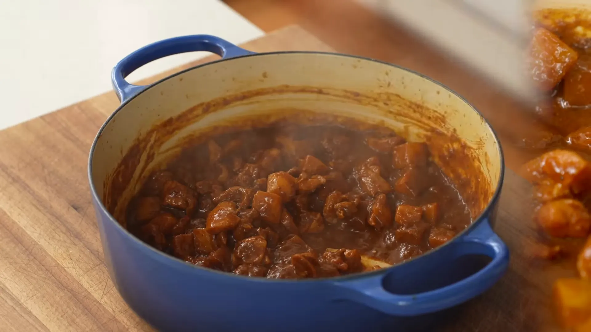 Vindaloo simmering with potatoes and chicken