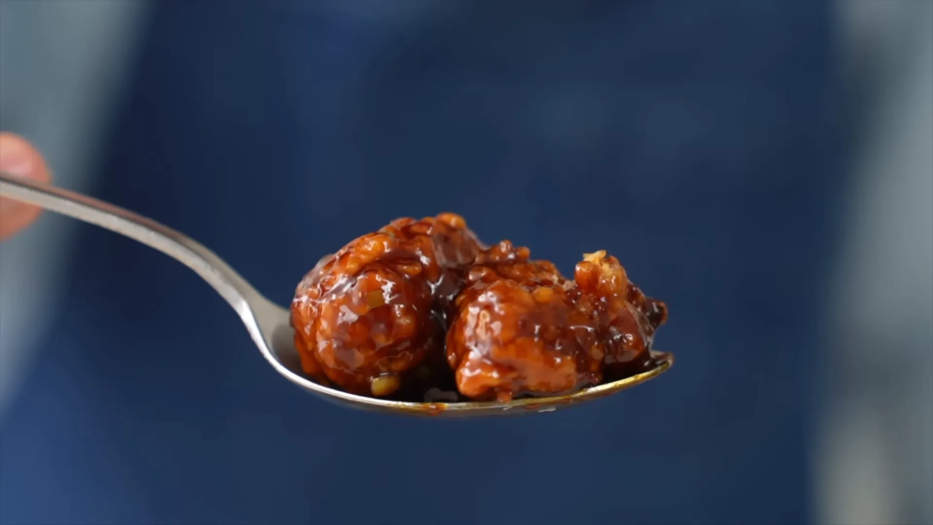Plated sticky General Tso's chicken, glossy and crunchy