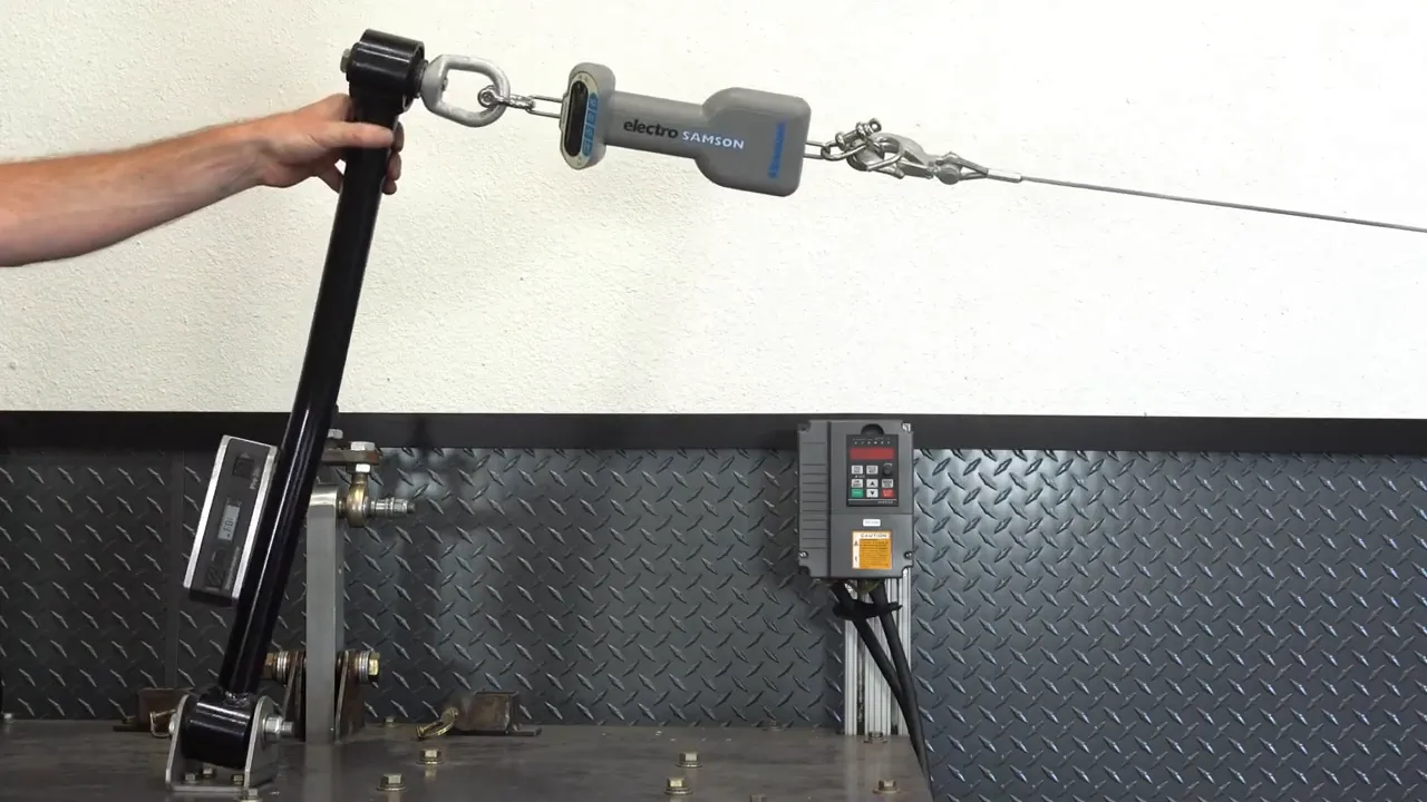 Control arm and bracket flex joint test rig showing actuator and load path