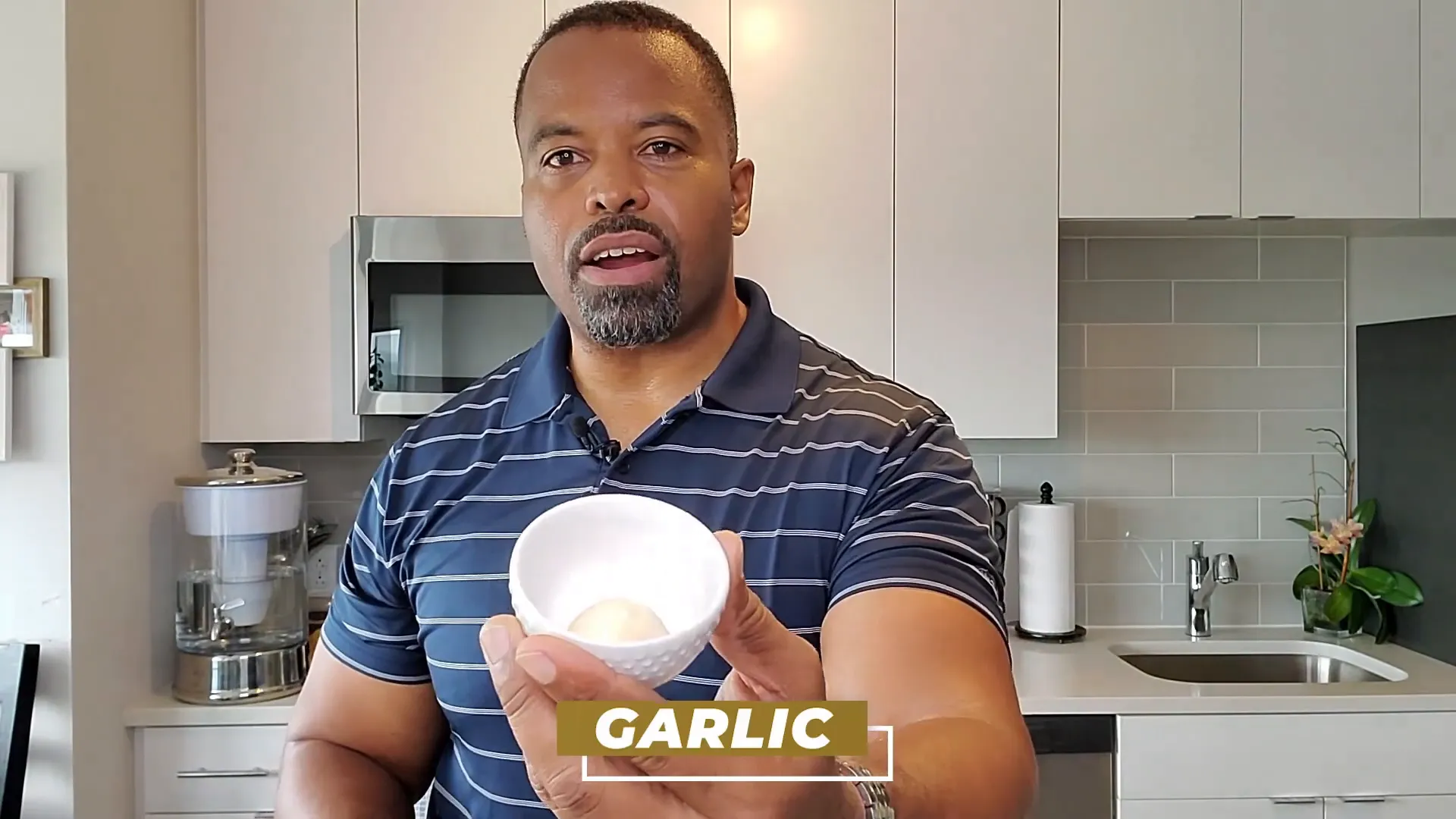 Garlic clove inserted into orange slice