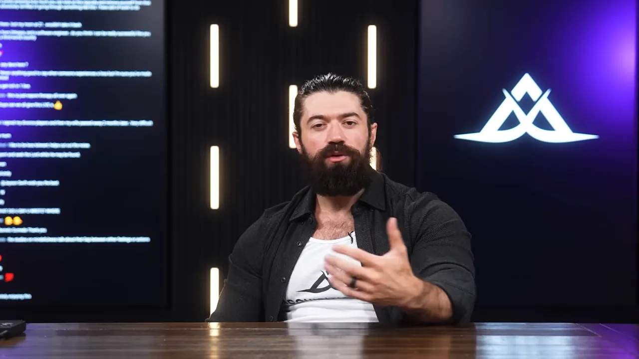 Host gesturing while seated at a desk in a studio with GFunnel logo and vertical lights behind