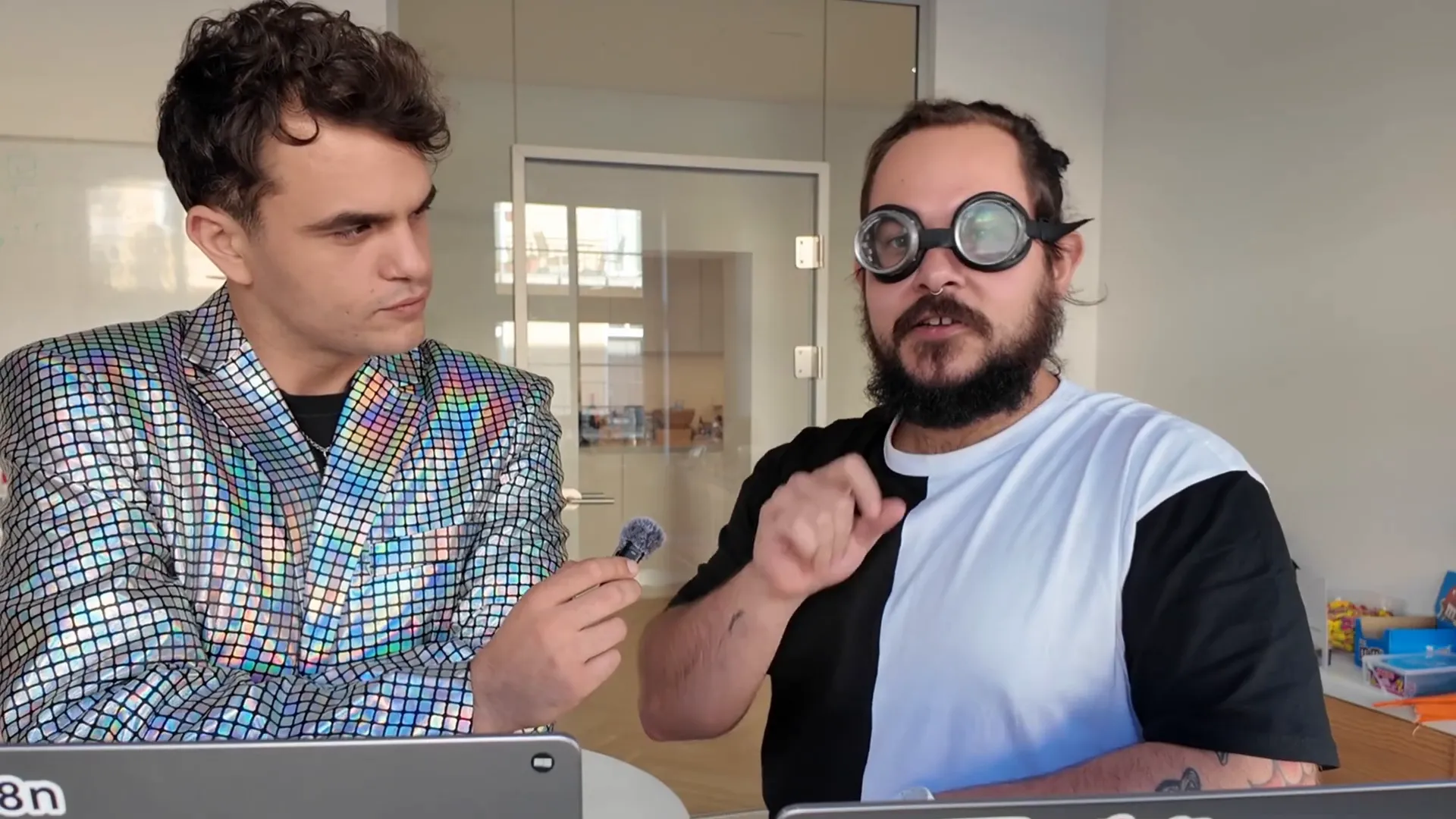 Dr Pure Eval smiling while teasing about rap challenges