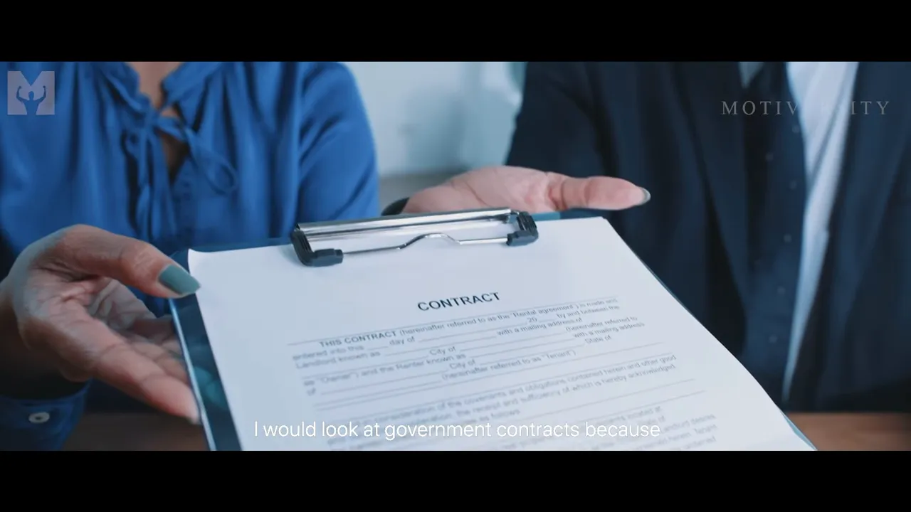 Close-up of a contract on a clipboard held by two business people