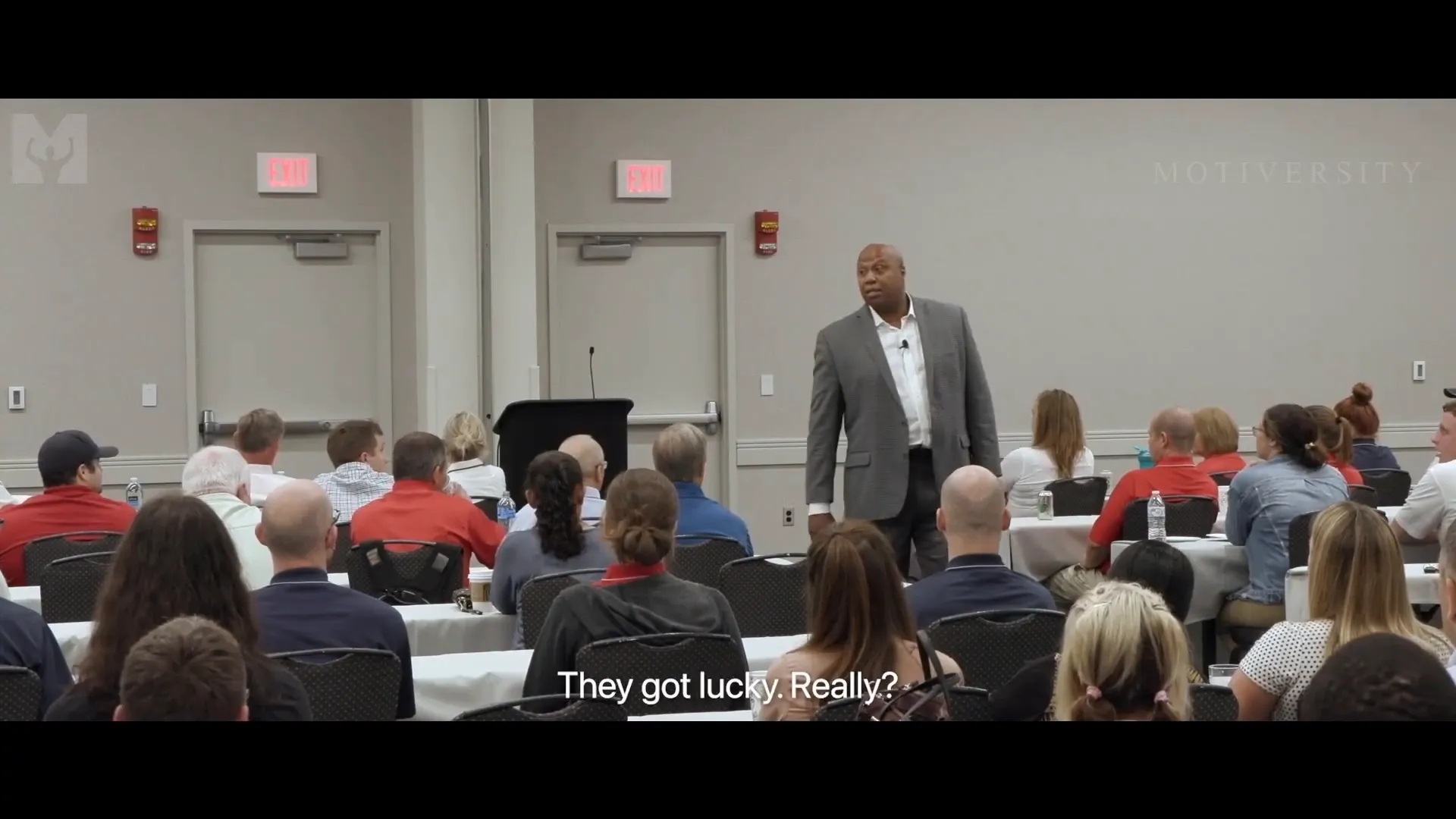 Motivational speaker inspiring entrepreneurs with shark mindset