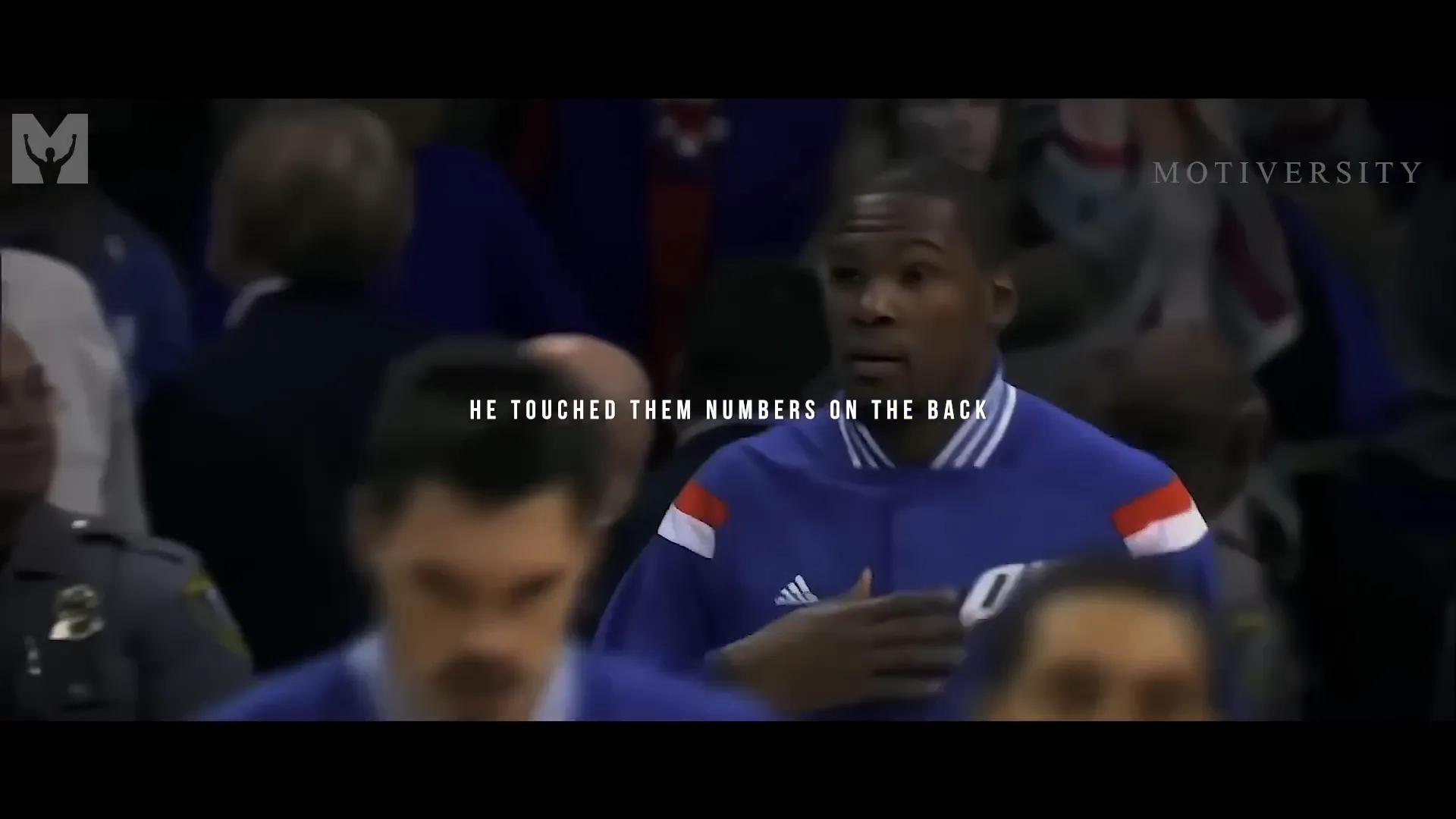Kevin Durant touching his jersey numbers in honor of his coach