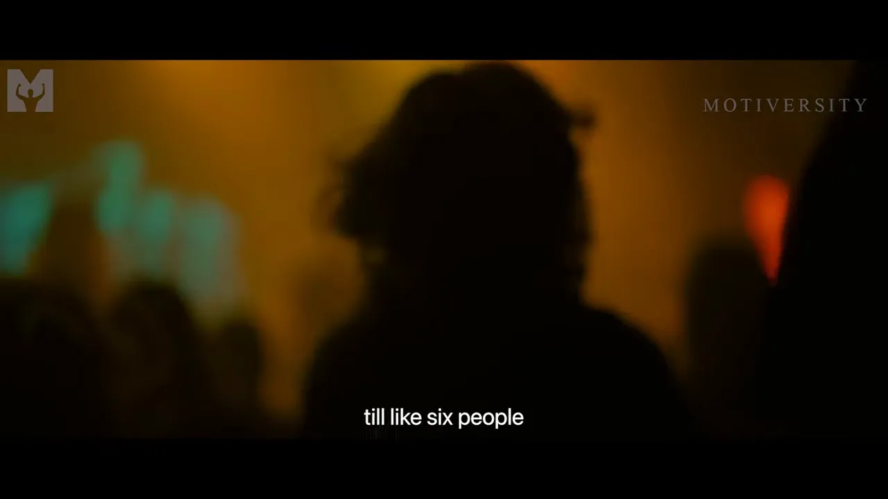 Lead singer of Anvil performing passionately to a small audience, symbolizing resilience