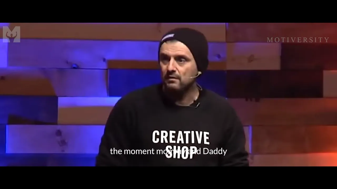 Keynote speaker on stage in a clear frontal shot wearing a 'Creative Shop' sweatshirt