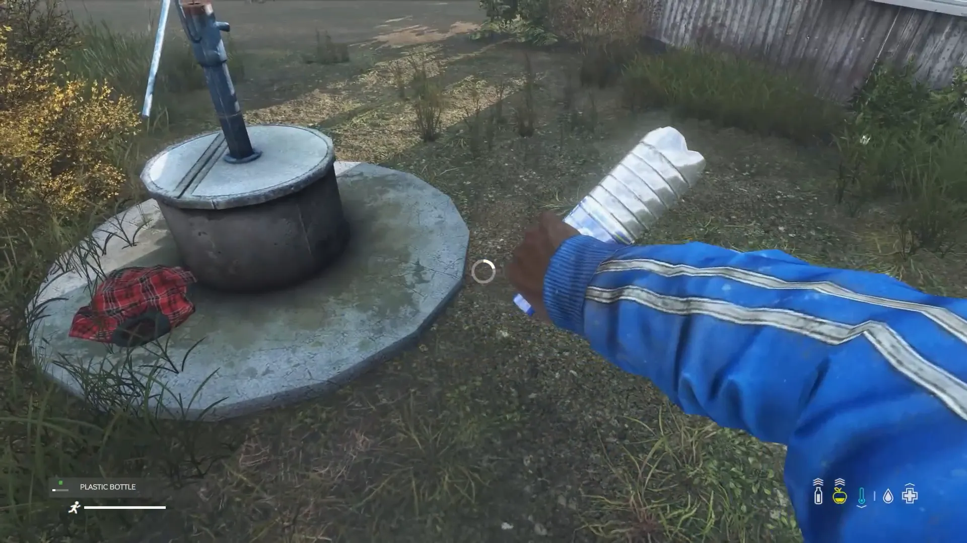 Filling a water bottle at a well