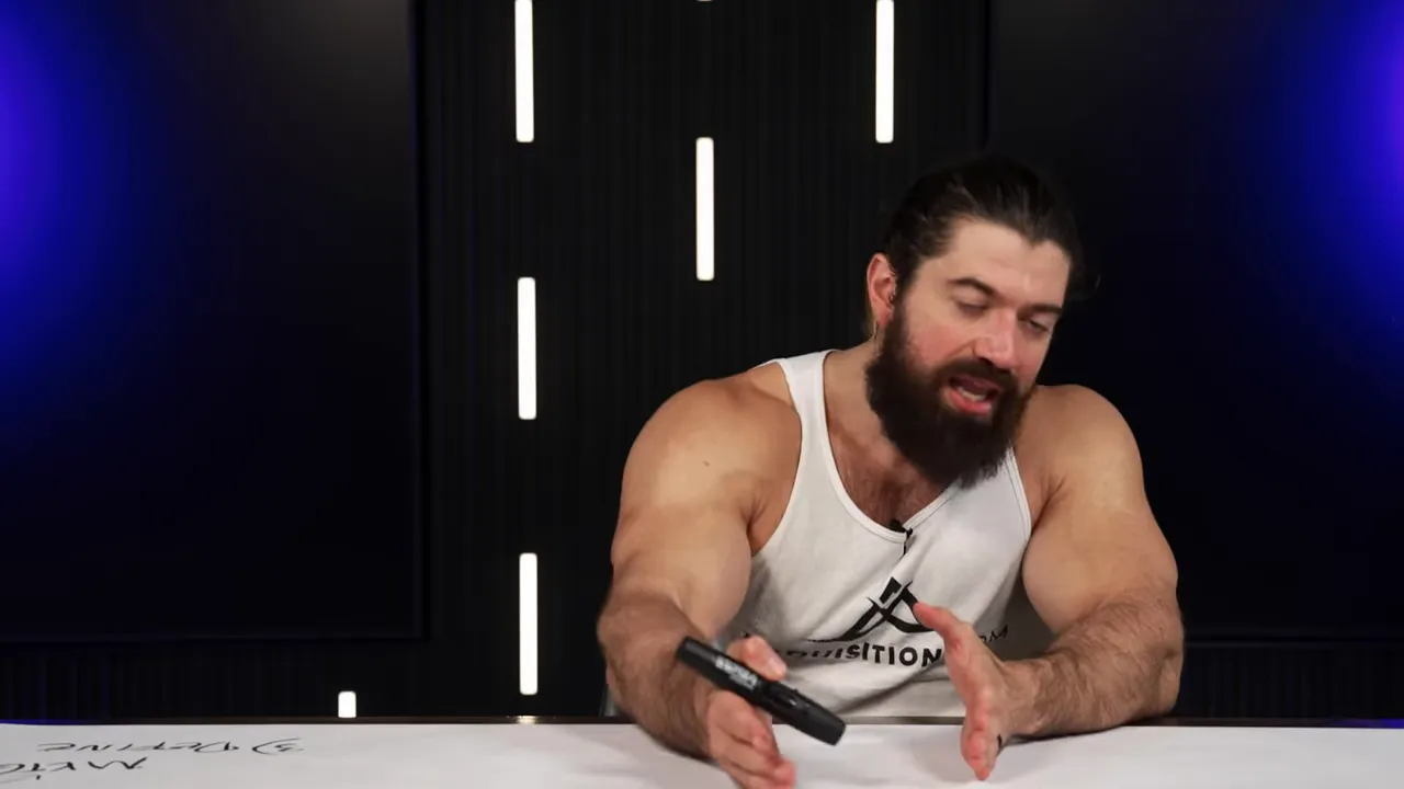 Presenter reaching forward with a marker, illustrating a point on the table