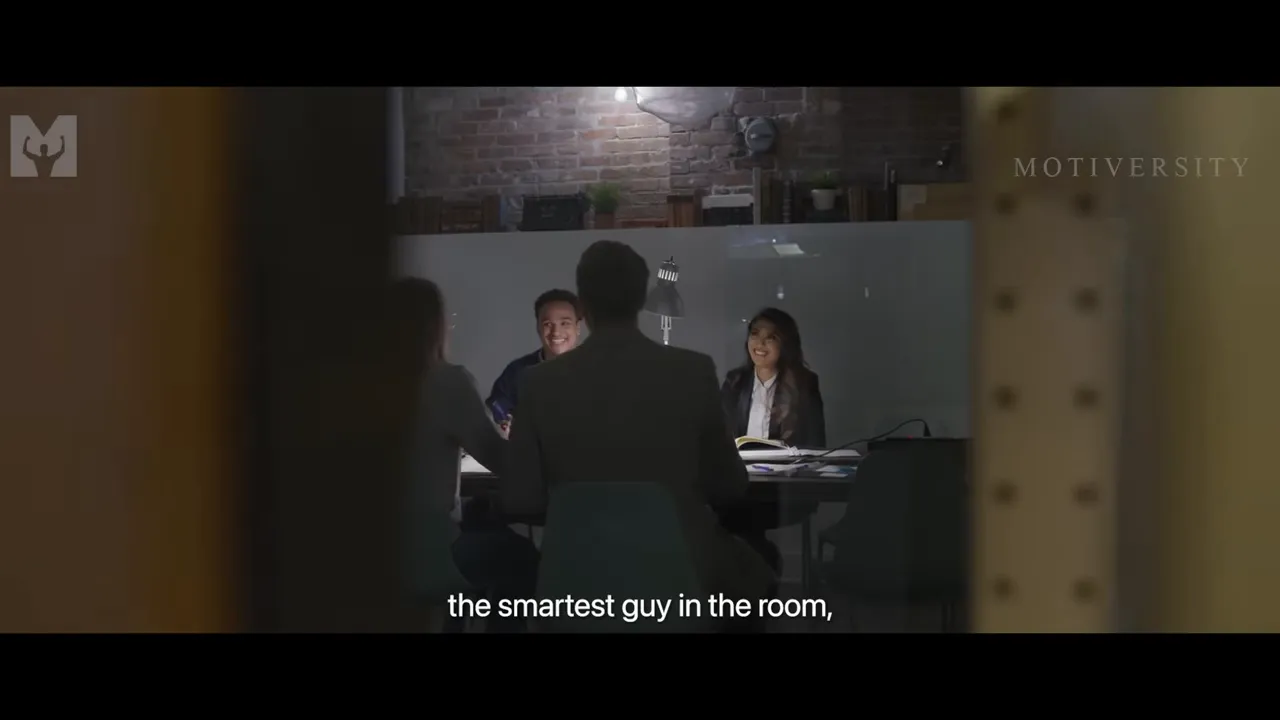 Room full of negotiators where one person remains quiet and listens