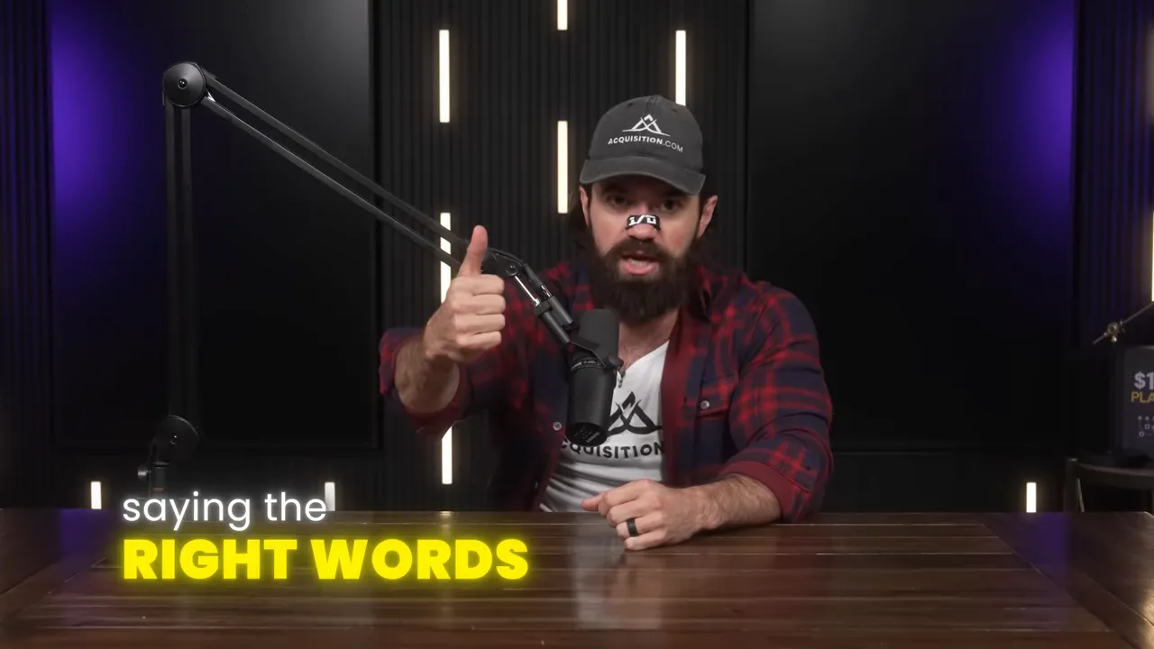 Speaker at a desk with microphone and on-screen text 'saying the RIGHT WORDS'.