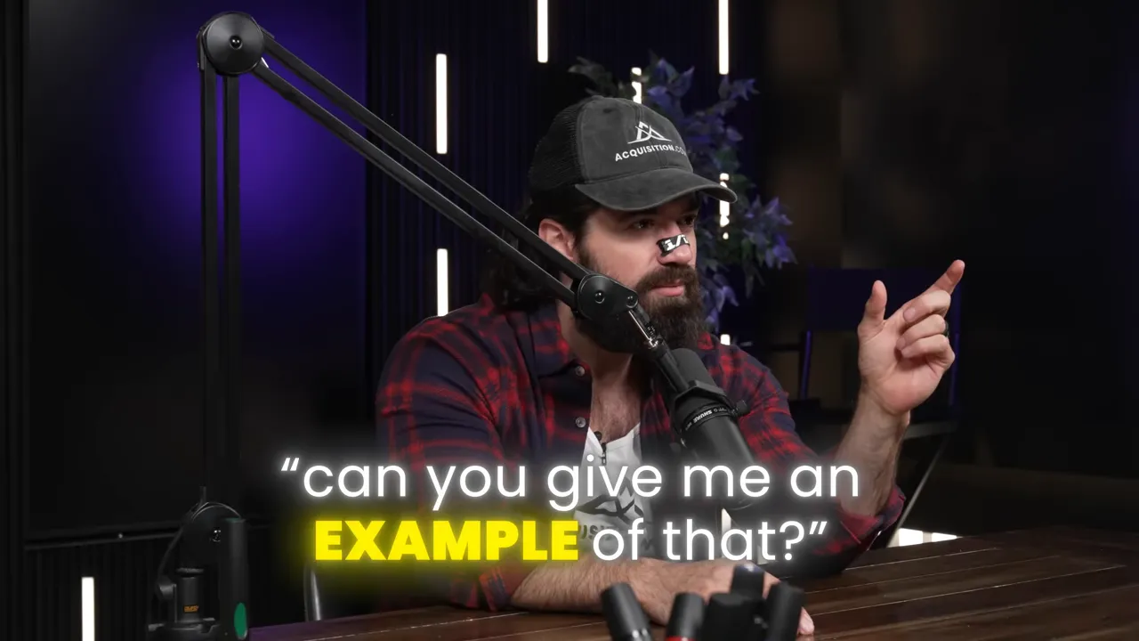 Podcast host pointing with text overlay: 'can you give me an EXAMPLE of that?' demonstrating asking for a specific example.