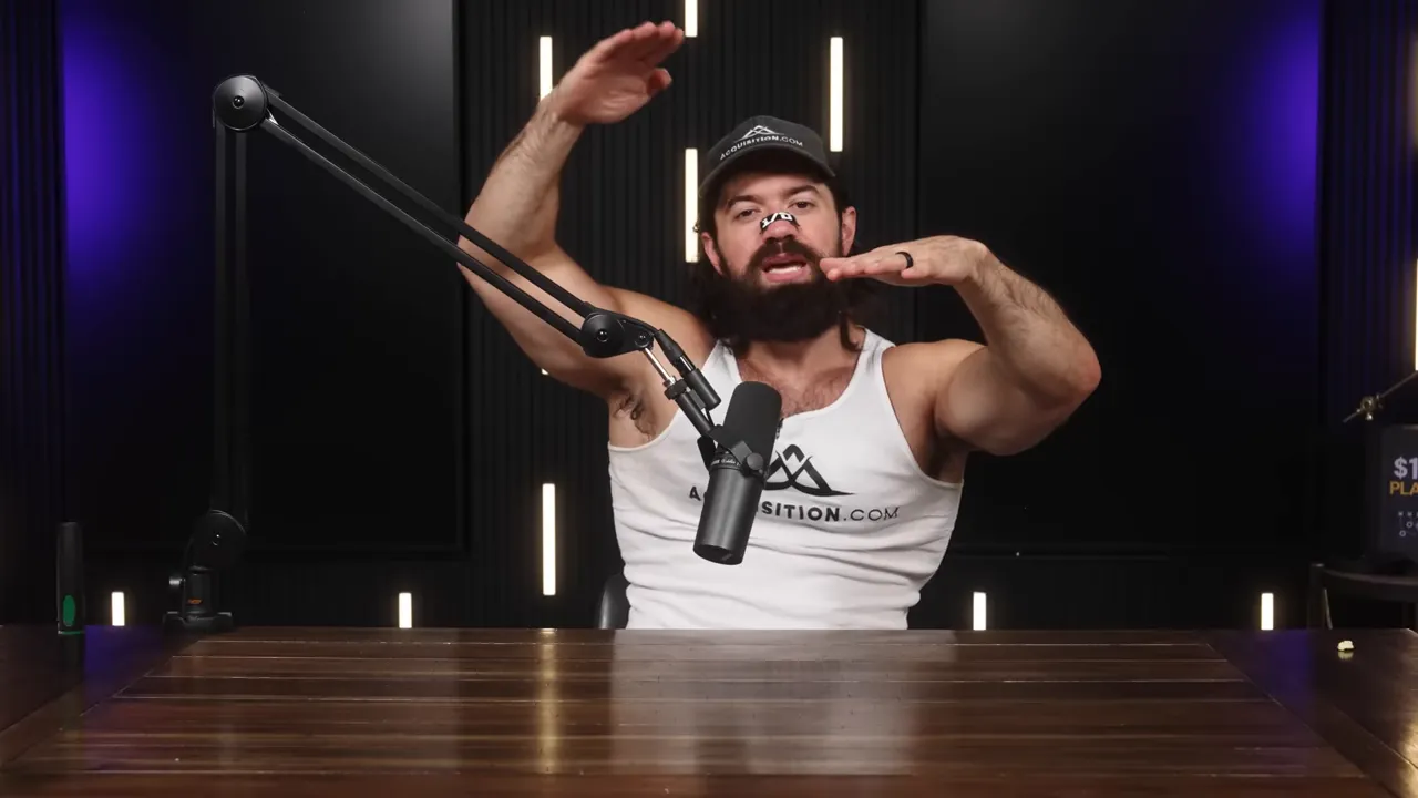 Presenter framing two different levels with his hands to show productive versus unproductive work in a podcast studio.