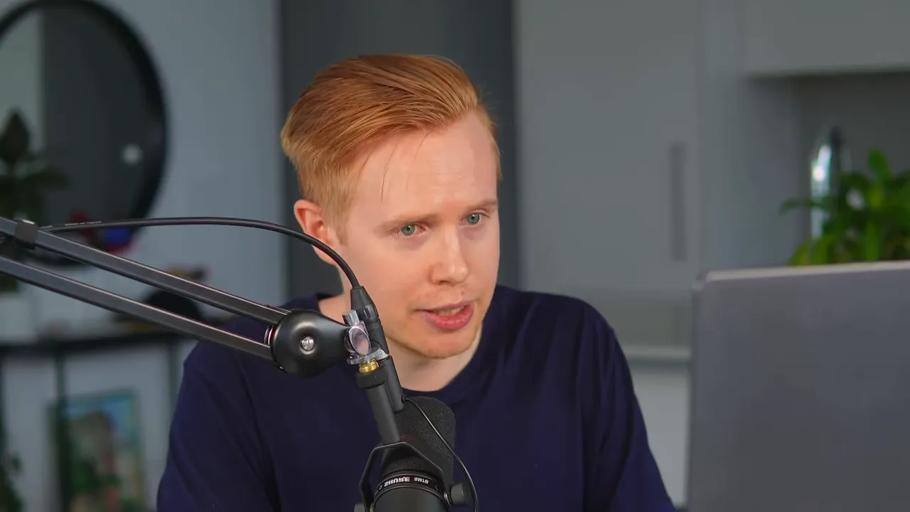 Presenter speaking into a microphone while looking at a laptop, explaining integration concepts