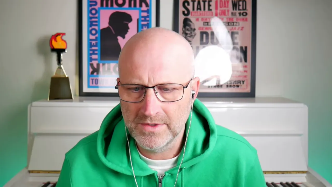 presenter in green hoodie looking at the screen while describing connecting N8N workflows to GFunnel