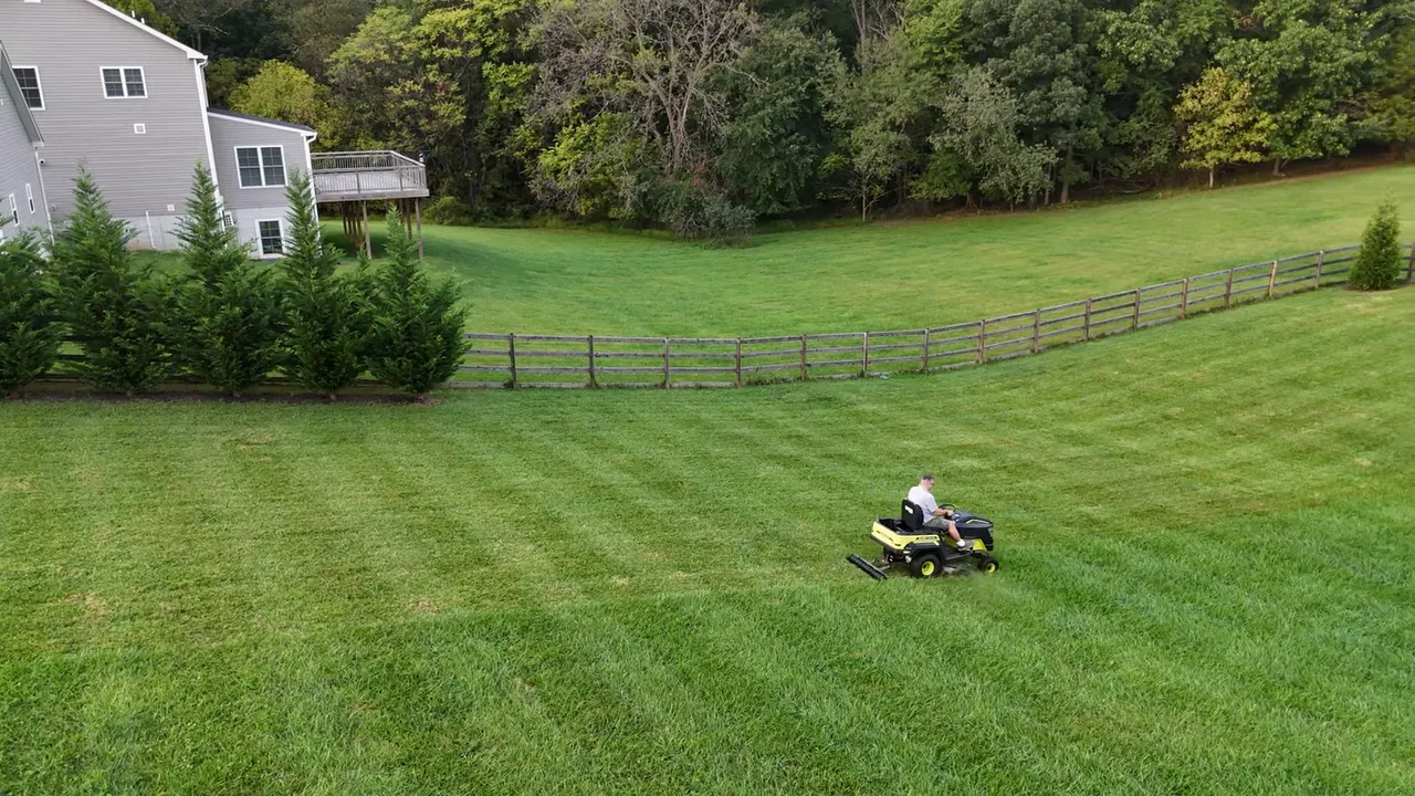Ryobi mower mowing footage showing grass being cut