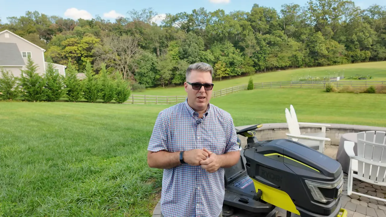 Creator waving goodbye next to the Ryobi mower