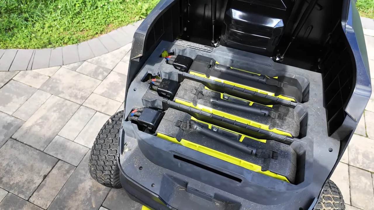 Under the hood showing three 80V battery packs installed