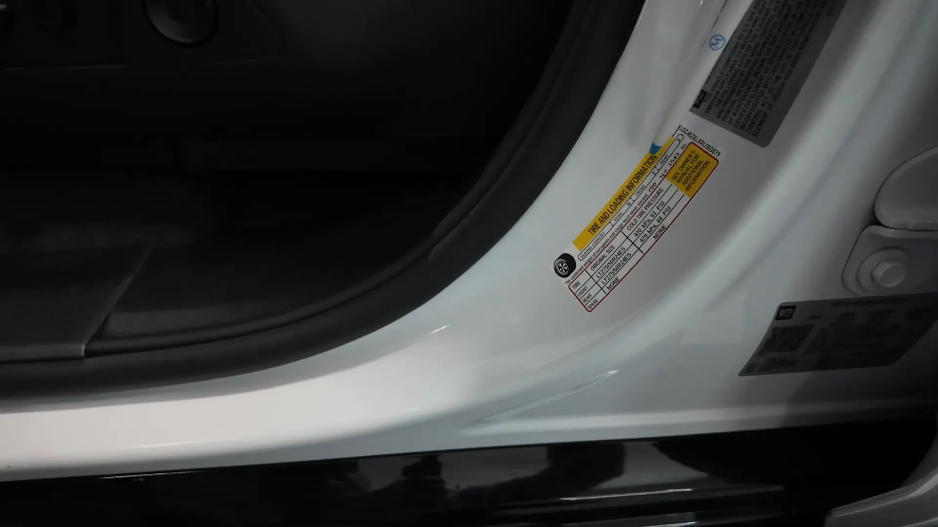 Tire and loading information sticker inside tow vehicle showing max payload