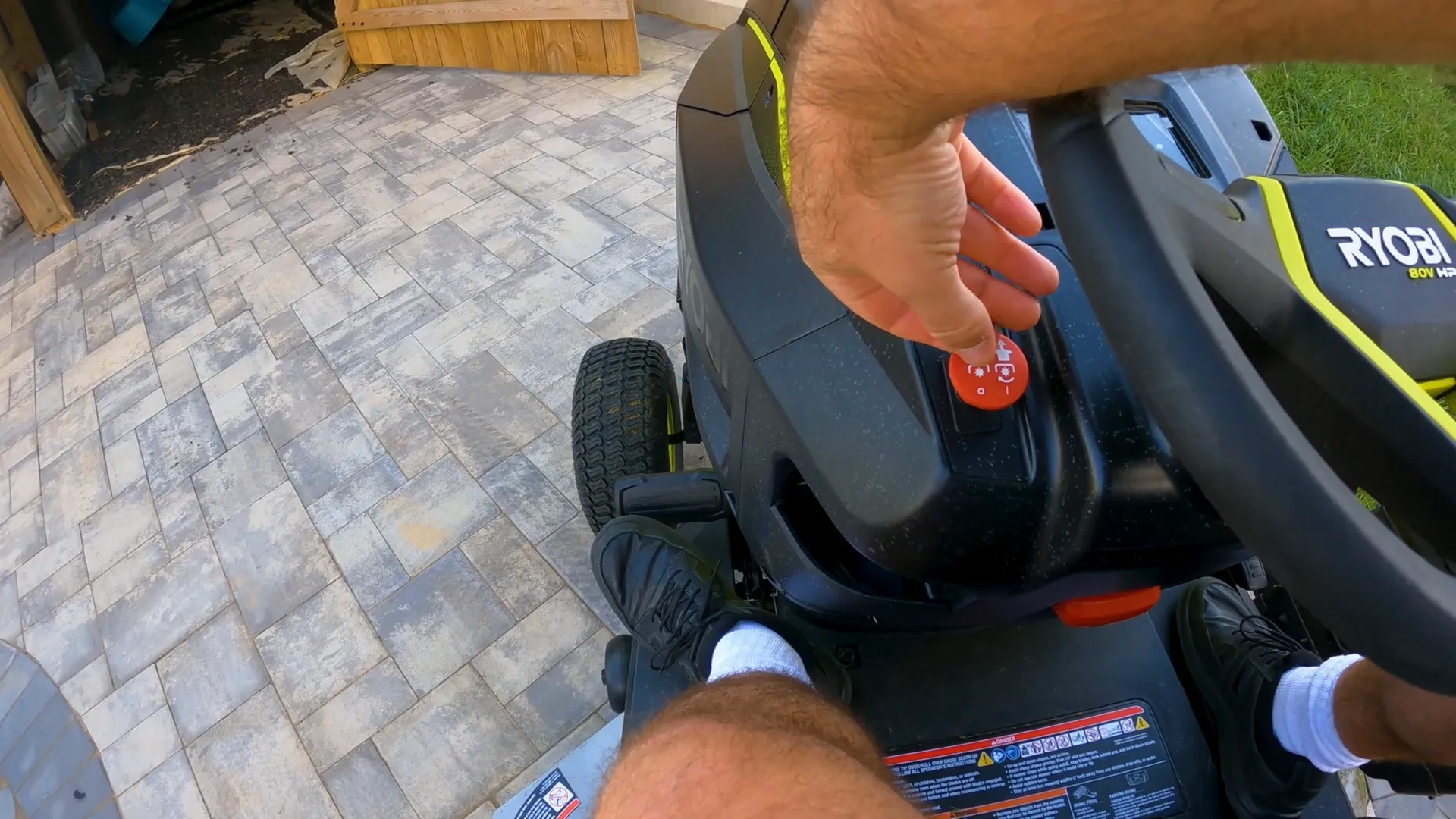 PTO engagement lever and control buttons on Ryobi lawn tractor