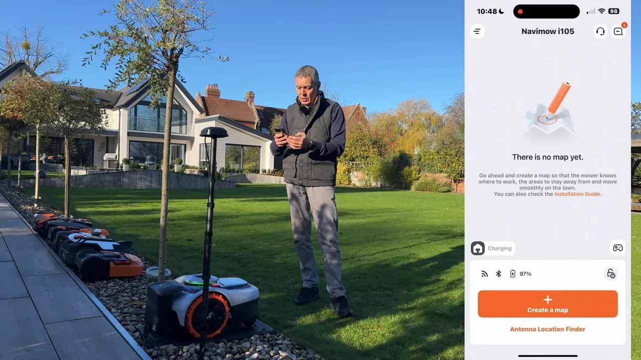 Navimow app screen showing 'There is no map yet' and a 'Create a map' button, next to the mower on its dock and the RTK antenna in the lawn.