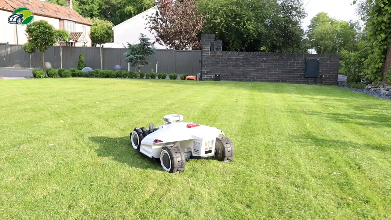 Luba 2 AWD robotic mower on lawn showing mowing stripes and wheel detail