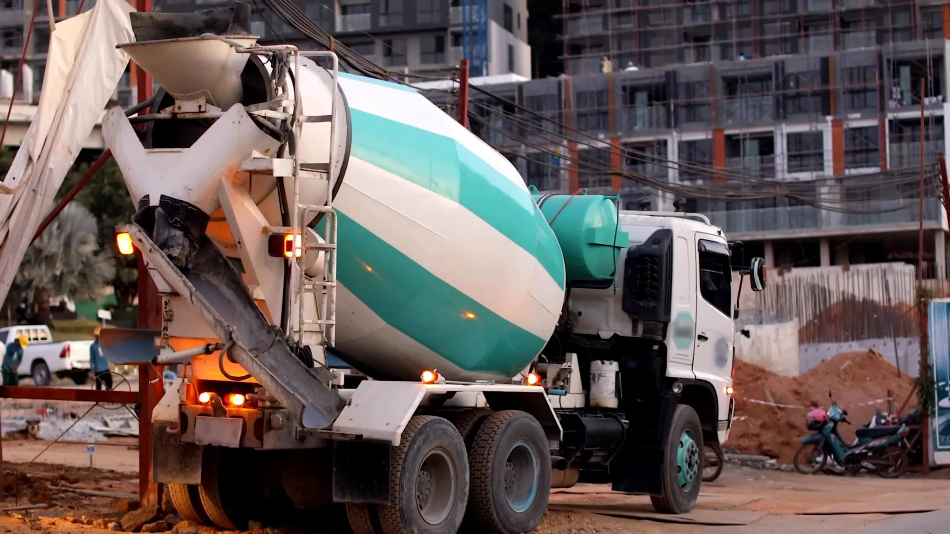 Concrete mixer truck mixing and transporting concrete