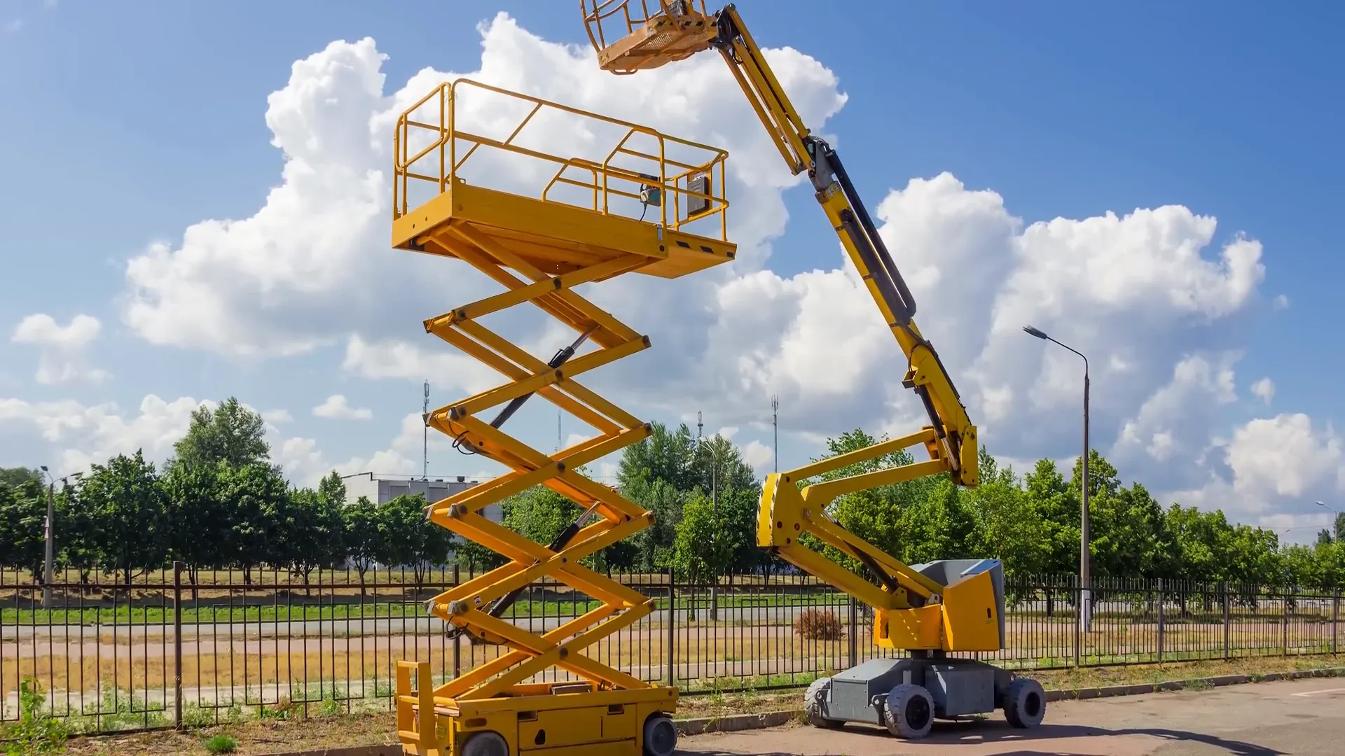 Worker operating boom lift platform