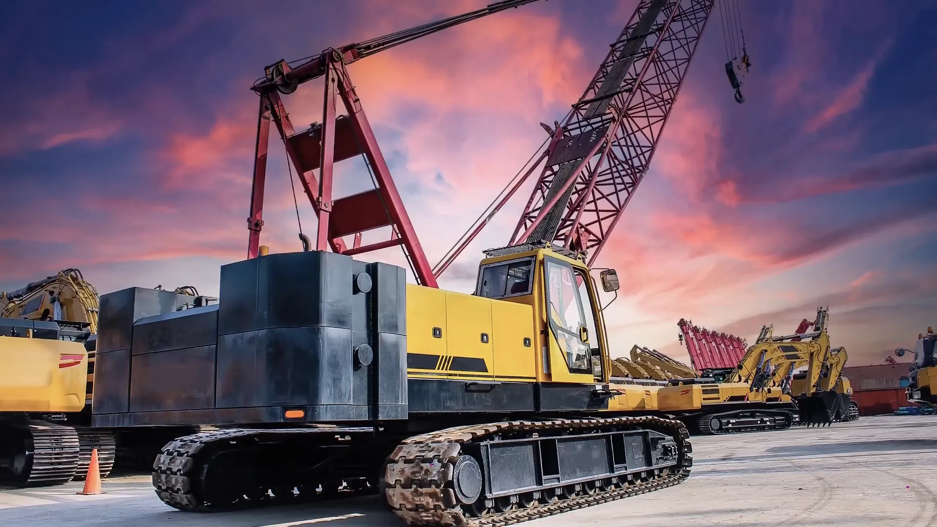 Crawler crane with extended boom on construction site