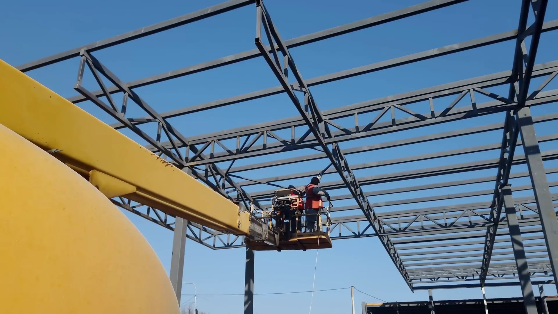 Boom lift elevating workers