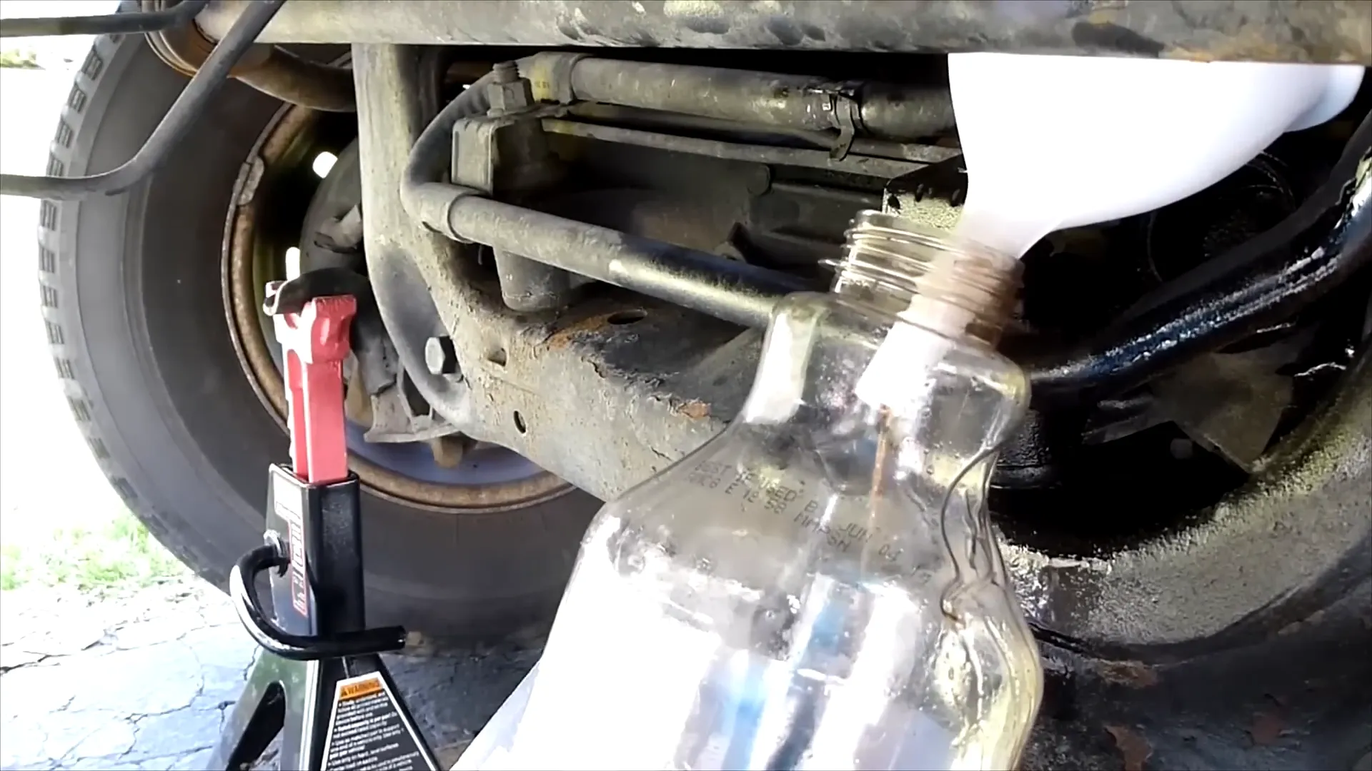 Power steering fluid being flushed