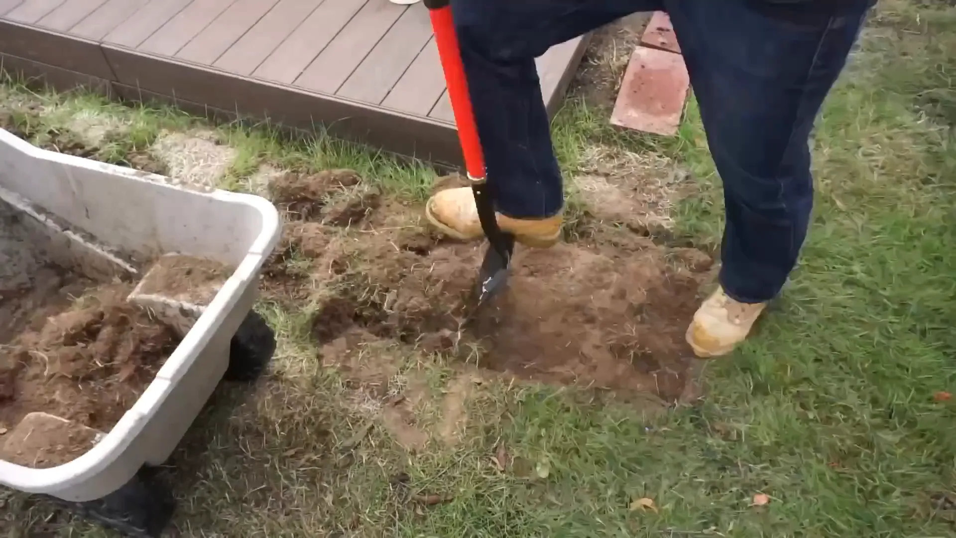 Digging out soil with spade shovel
