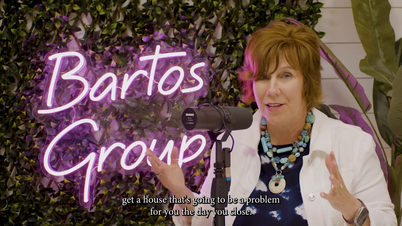 Studio host speaking into a microphone with a neon-branded backdrop, discussing home inspections