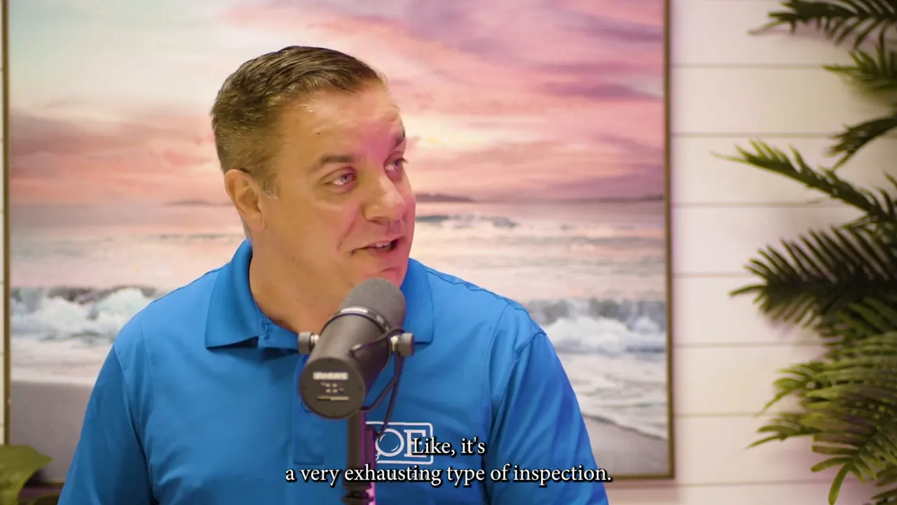 Inspector in studio speaking into a microphone with subtitles about inspections being a very exhausting type of inspection.