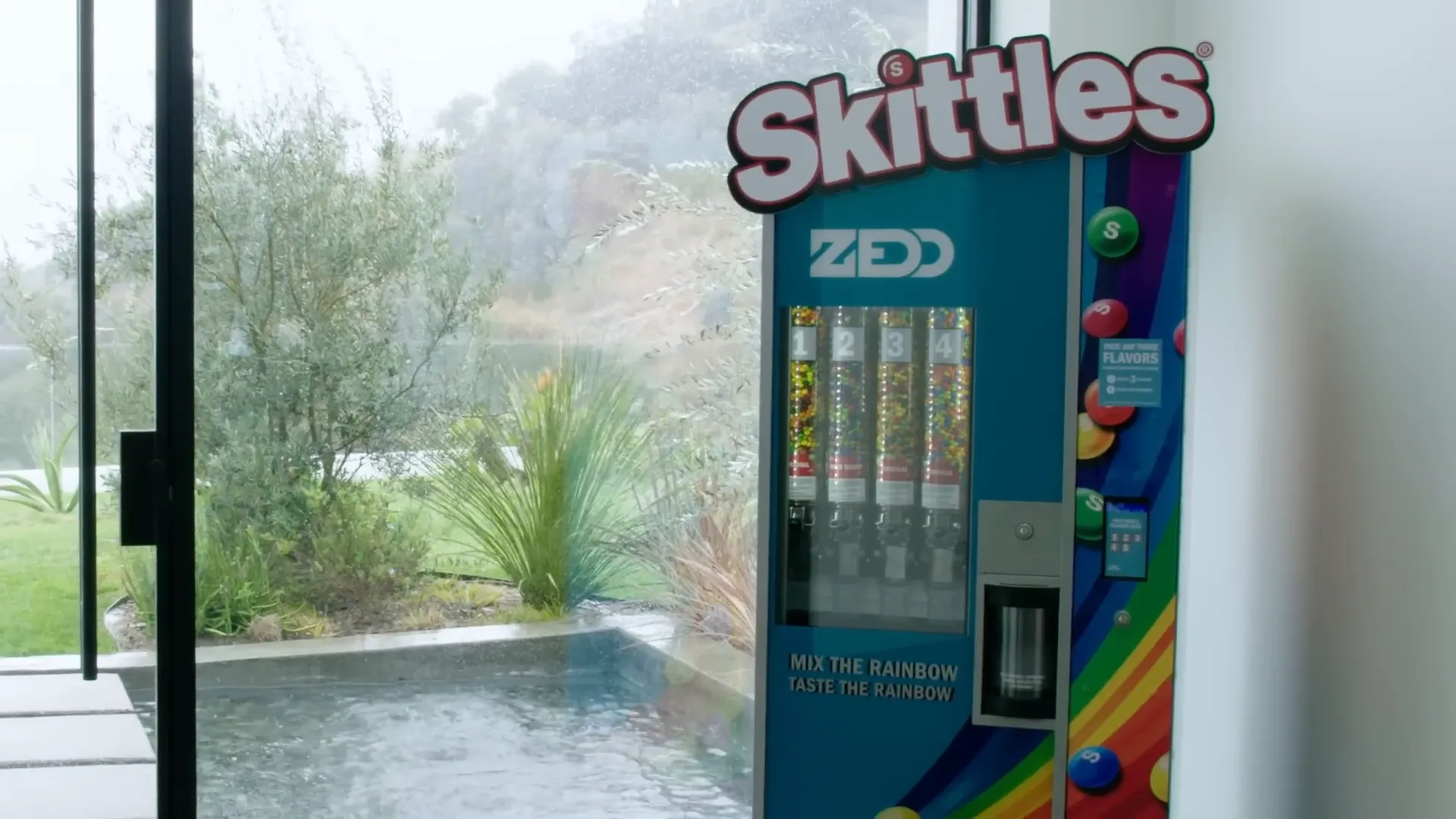 Zedd showing the Skittles machine
