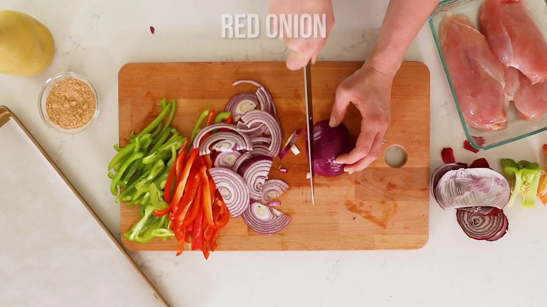Chopping veggies on a cutting board.