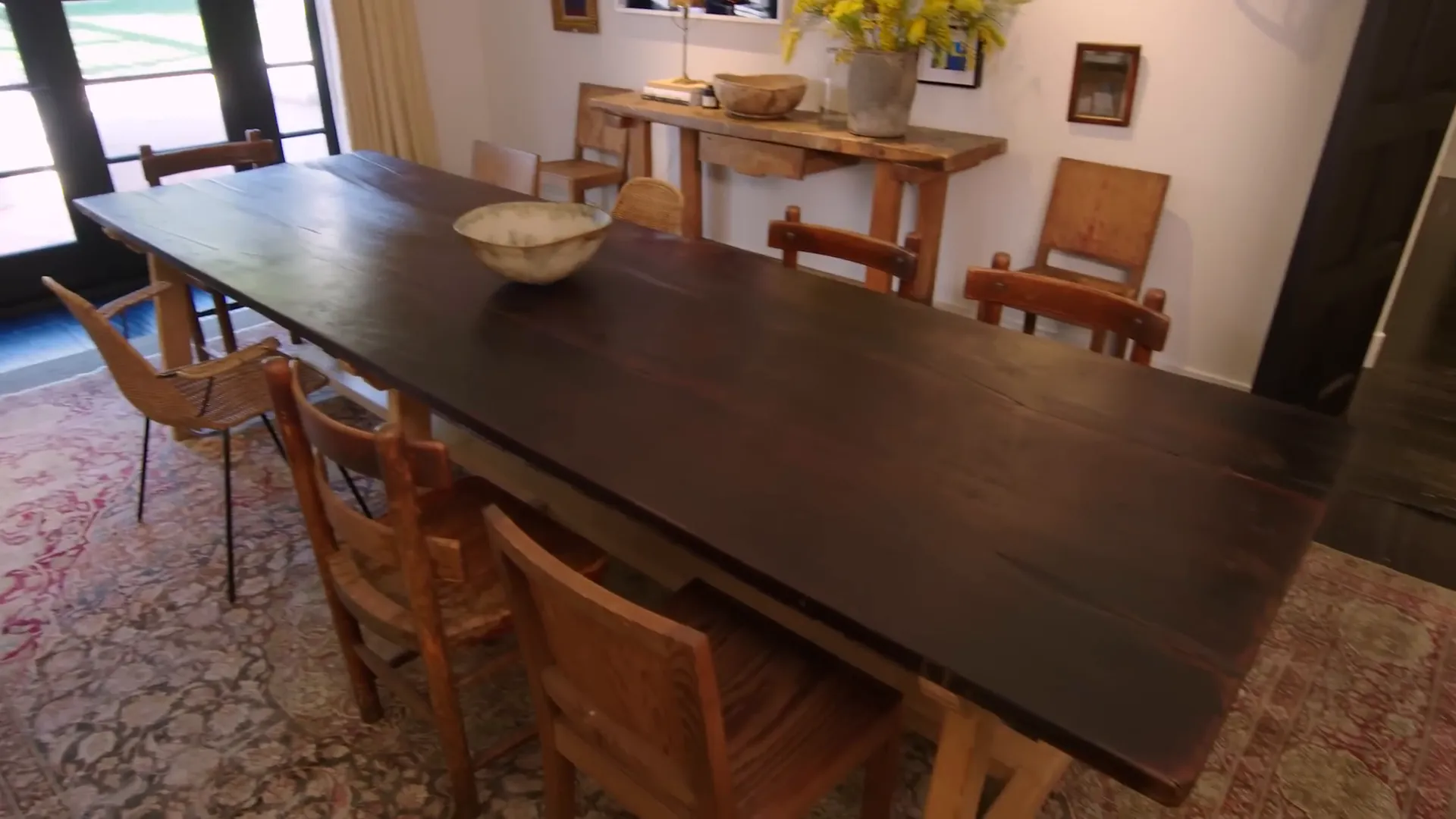 Dining room with open doors to the backyard