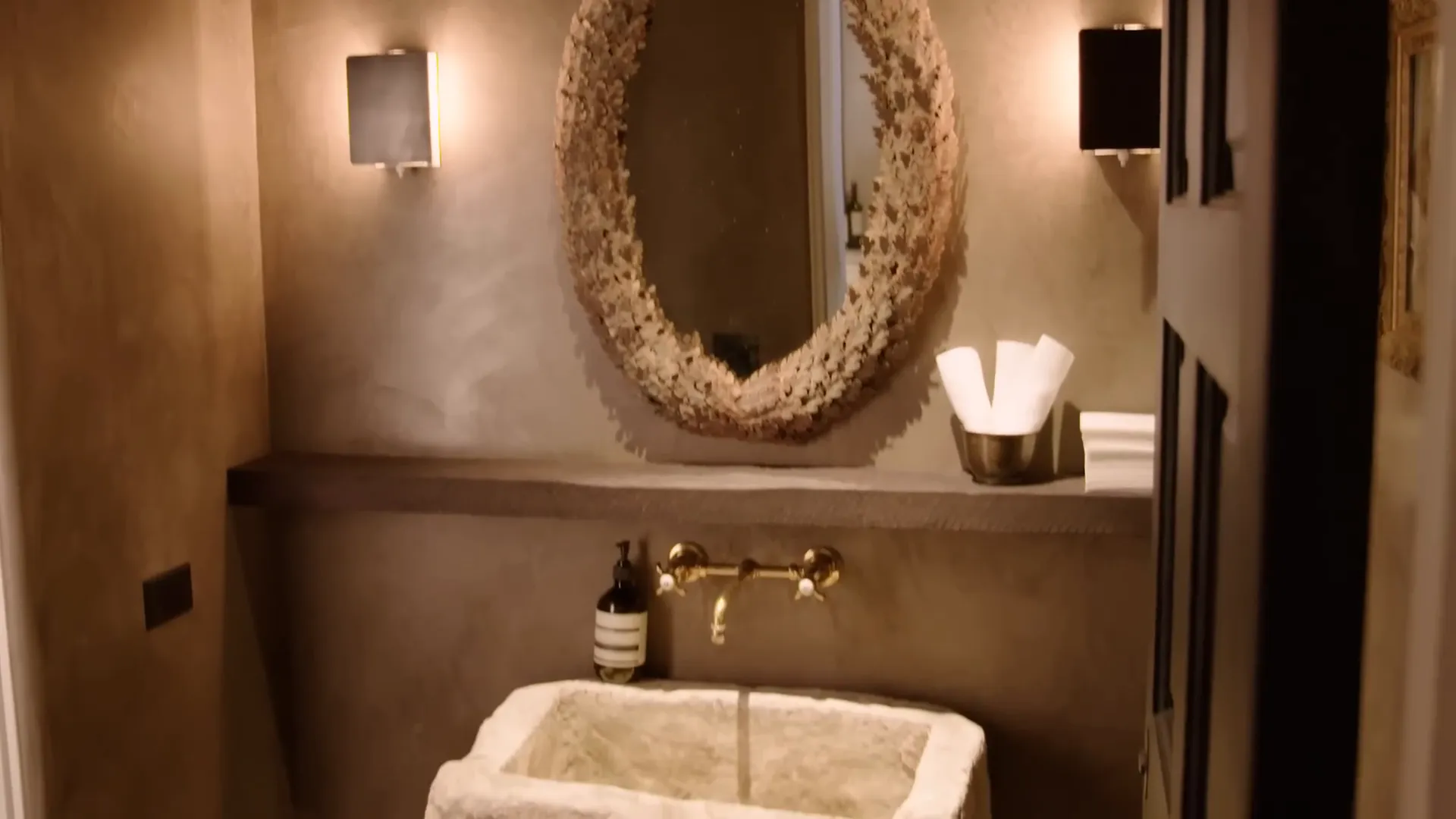 Moody powder room with stone sink