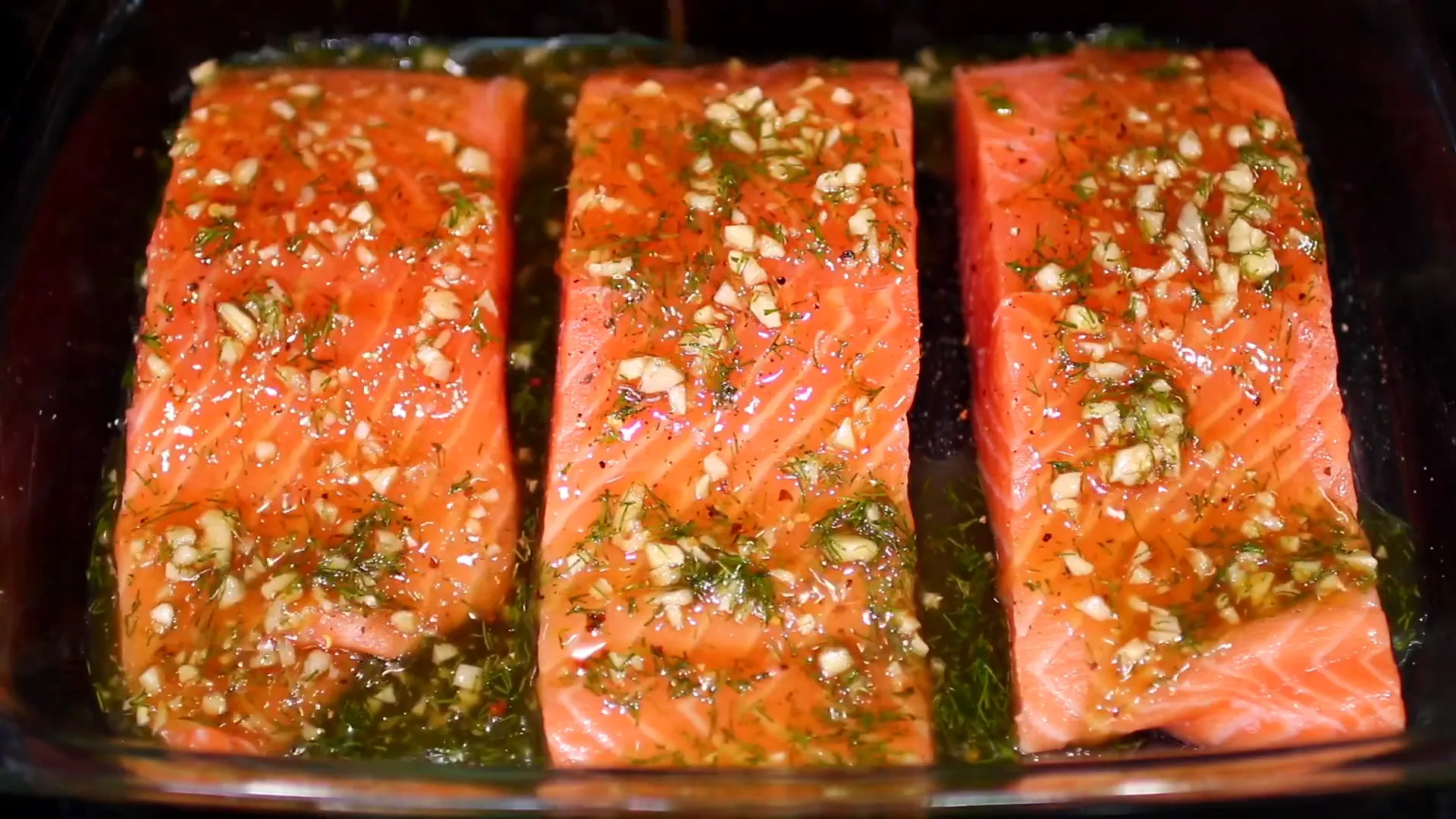 Pouring the marinade over the salmon