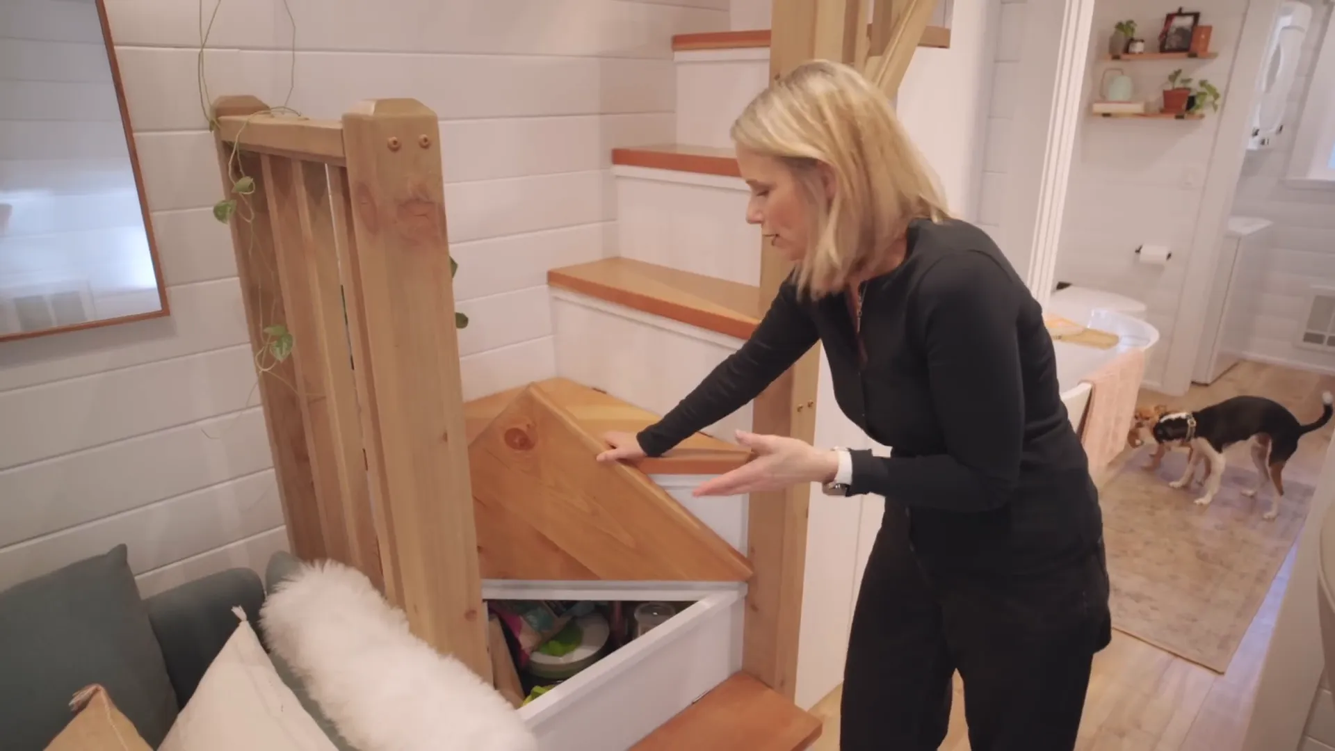 Amber shows her storage solutions in the tiny house.