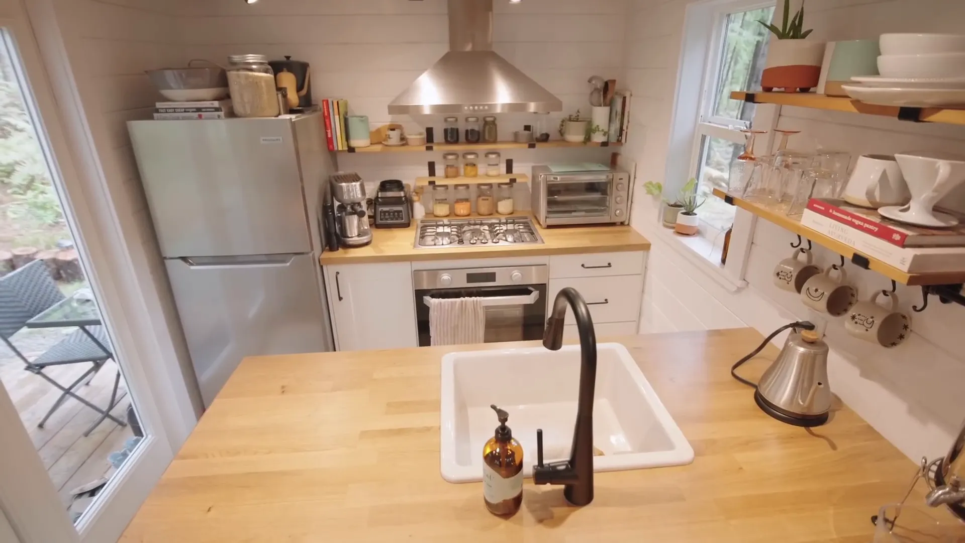 Amber's propane stove with cooking utensils.