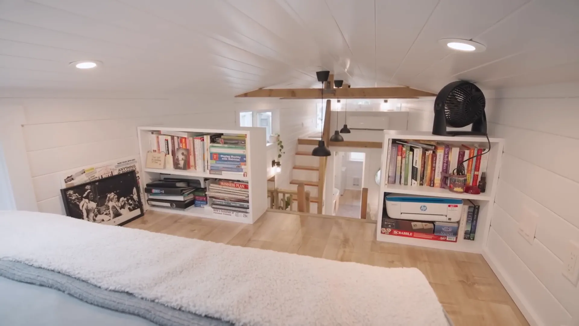 The guest loft with a cozy bed and skylight.