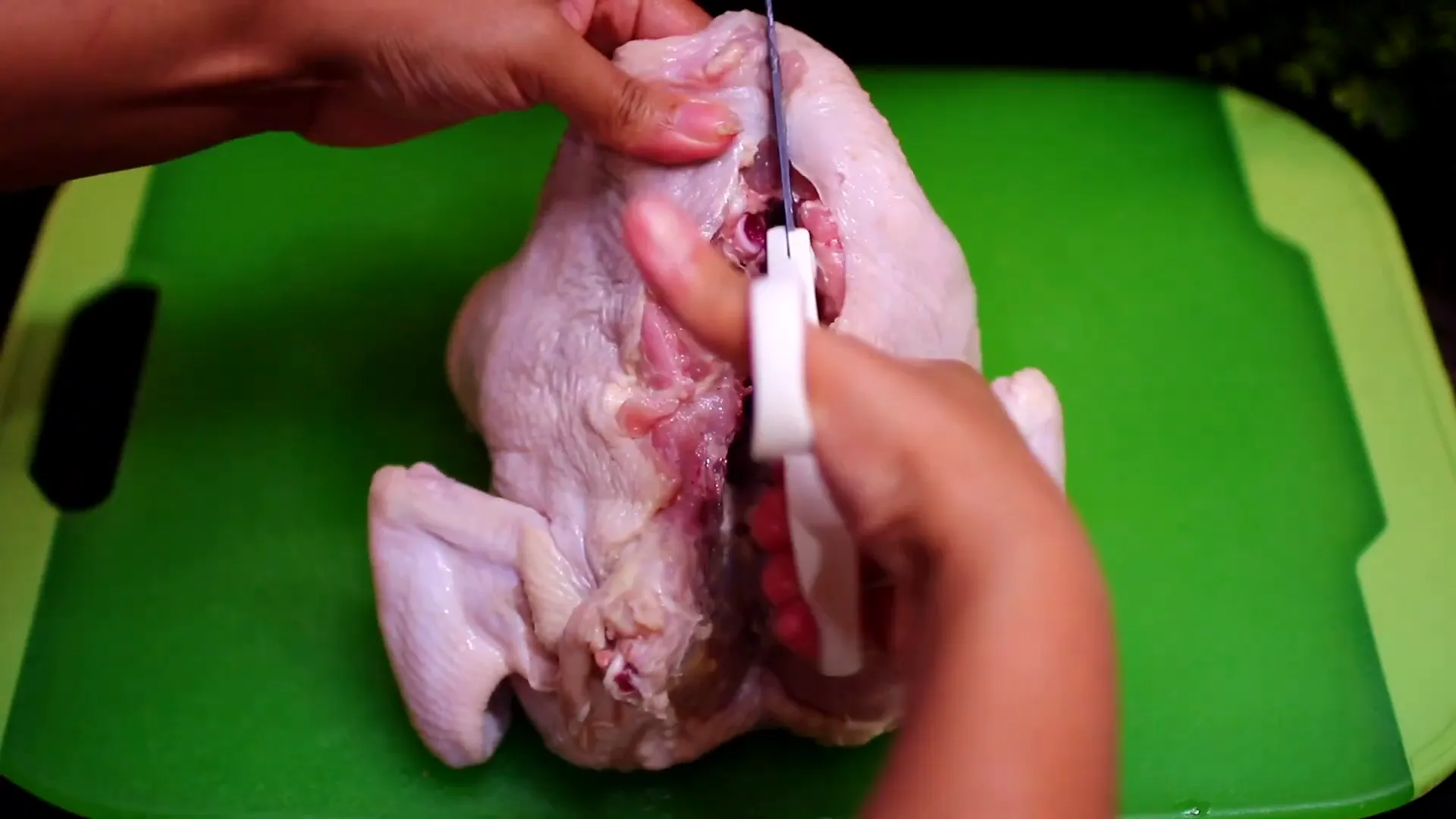 Cutting the backbone of the chicken