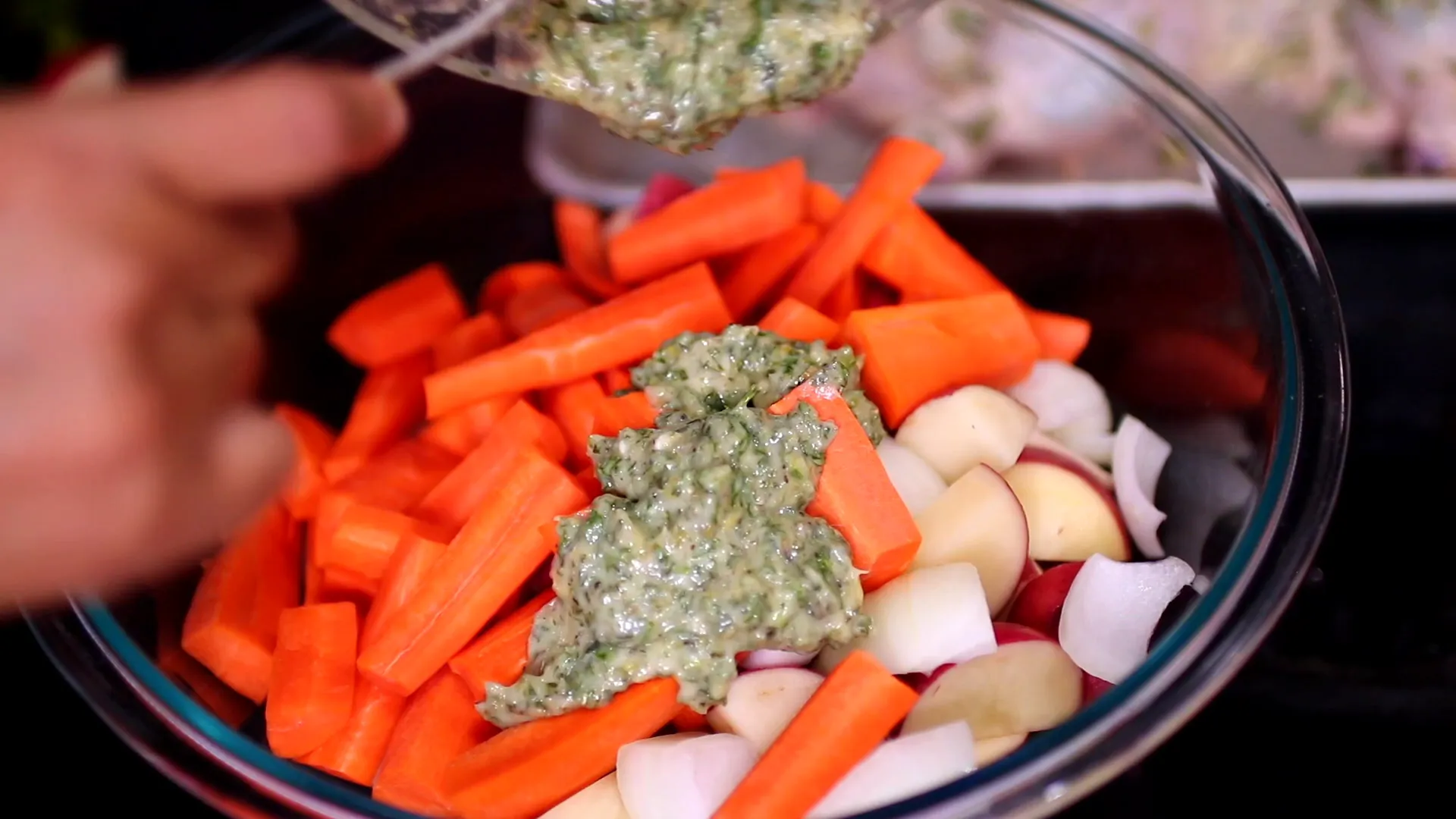Mixing vegetables with seasoning