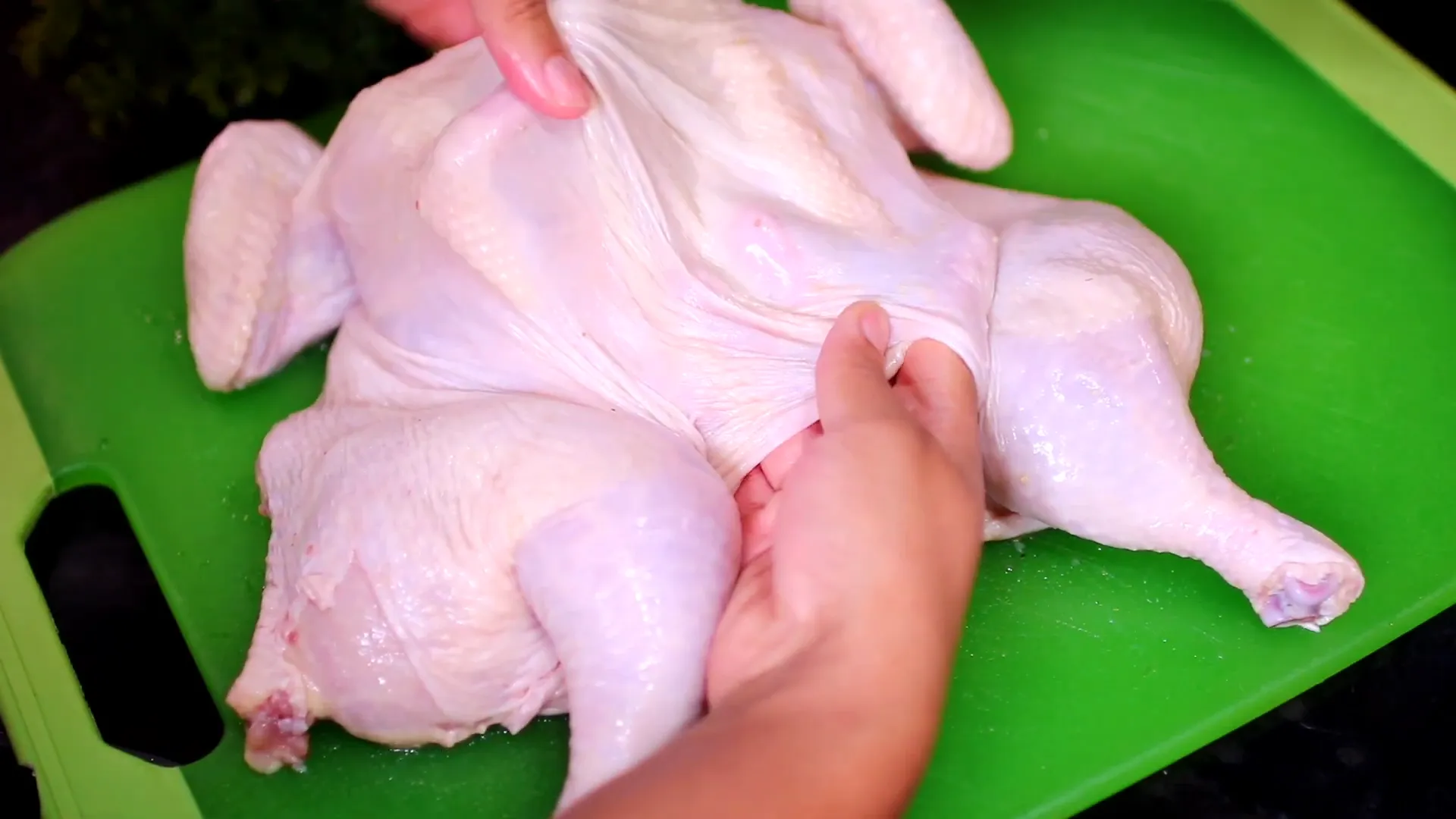Separating the skin from the chicken