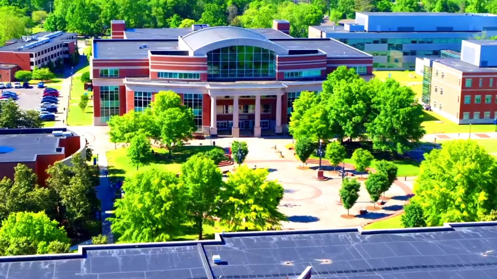 MTSU student walking across campus and the speaker reflecting on her daughter's positive experience
