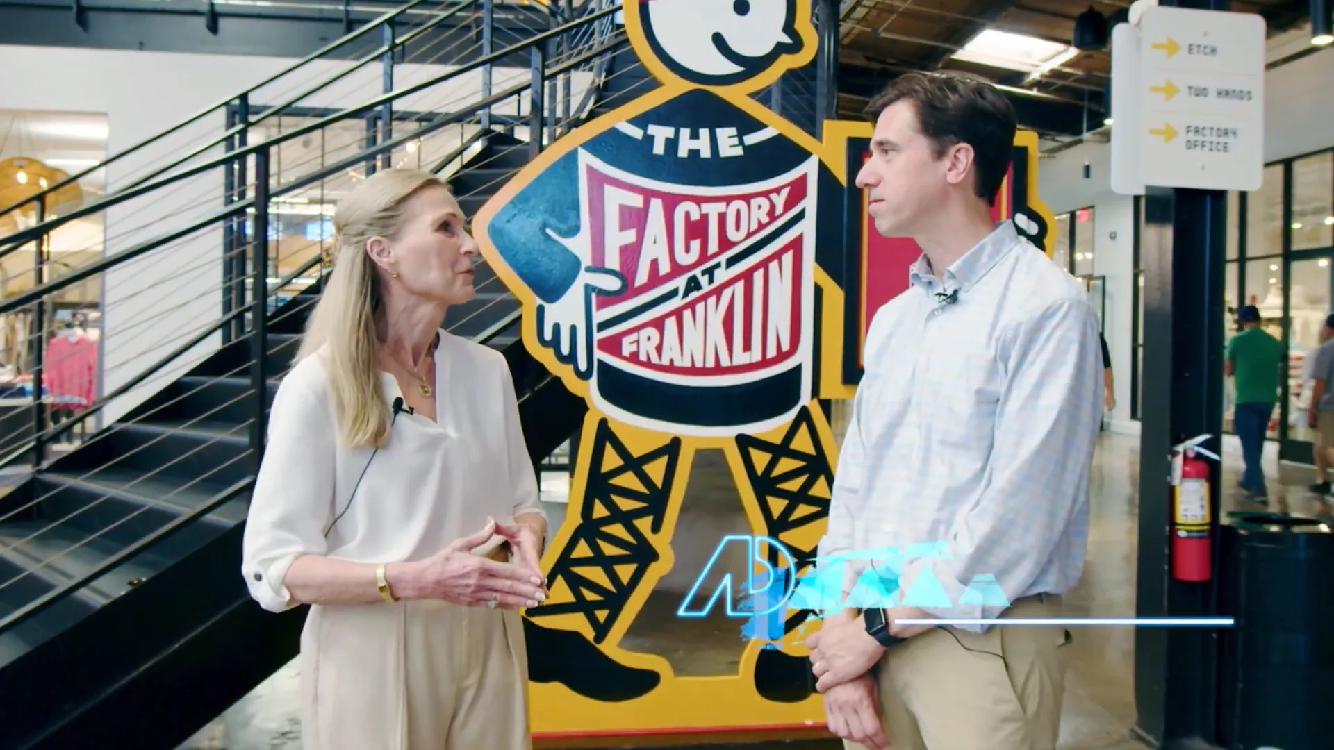 Ellen discussing the factory renovation