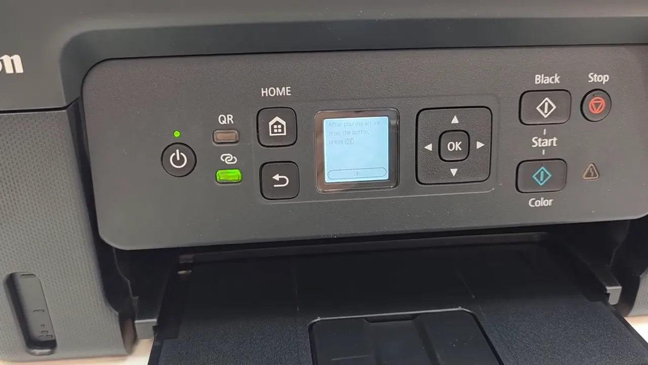 Printer display showing performing initial adjustments countdown